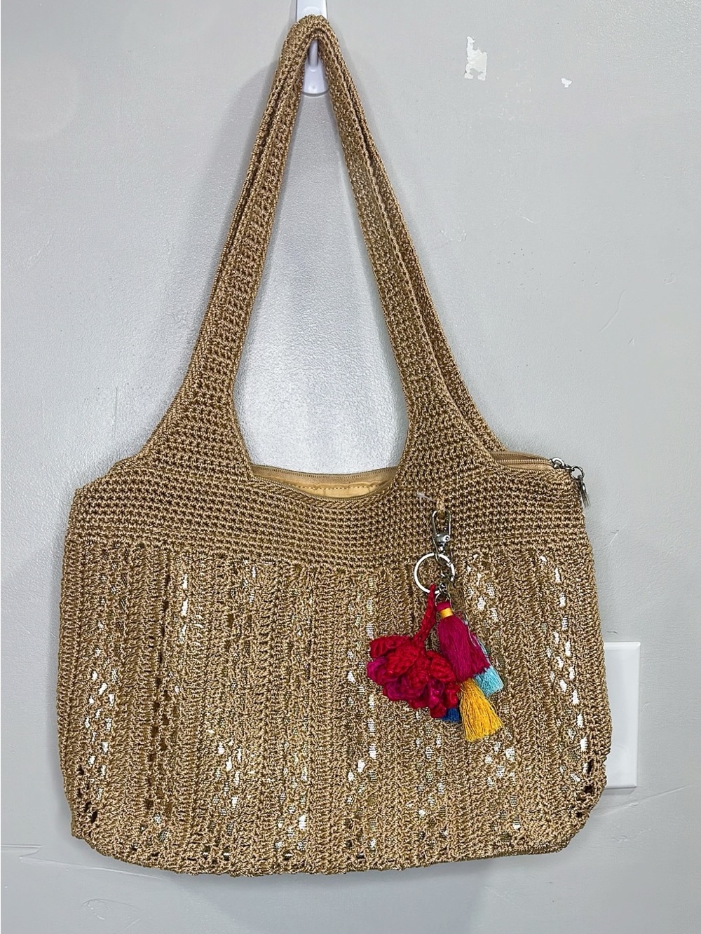 The Sak Casual Classics Large Tote Bag Woven Straw with  Tassel Charm-Tan.